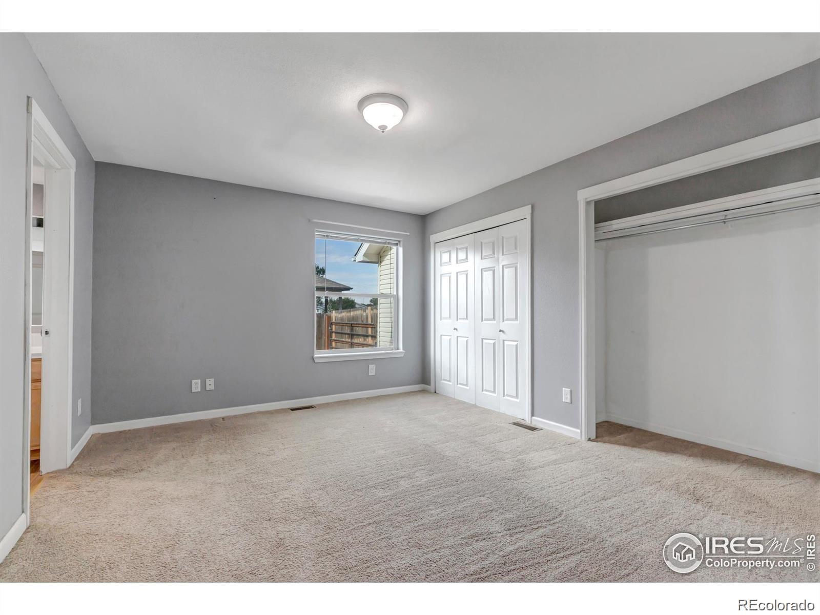 807 5th Street Pierce, CO 80650 - Photo 6 of 11 a view of an empty room with a window