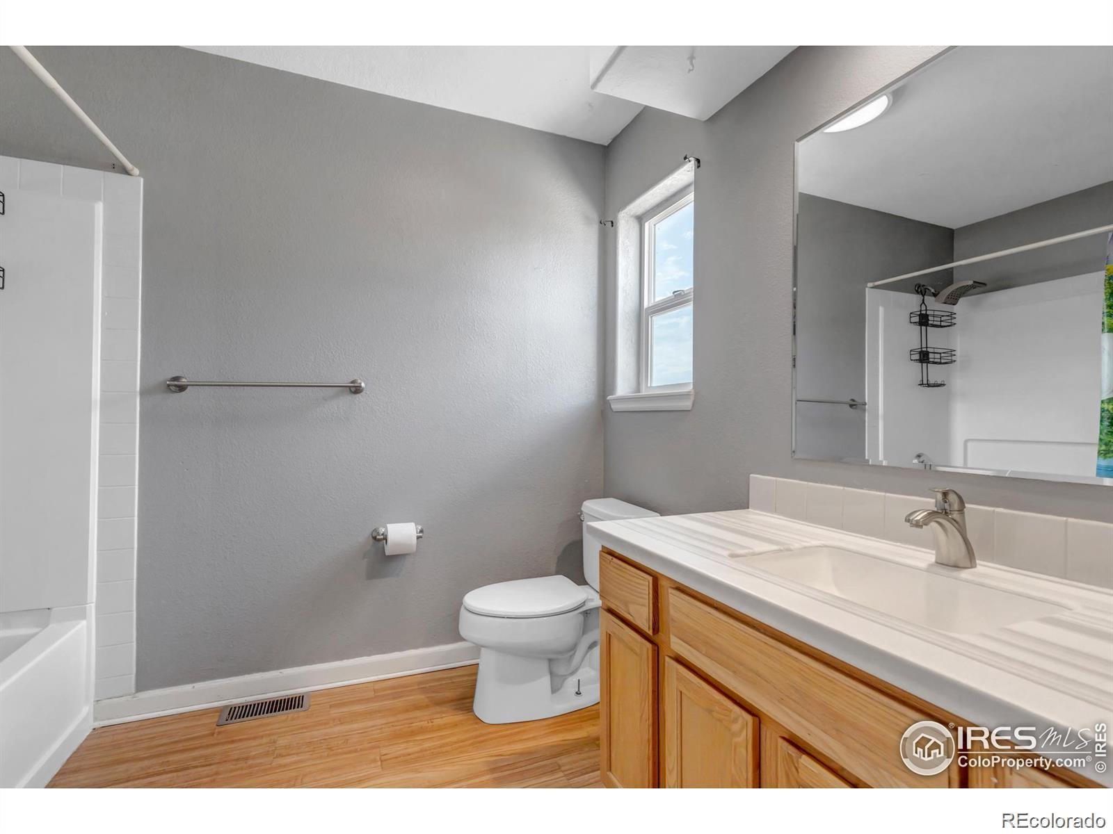 807 5th Street Pierce, CO 80650 - Photo 7 of 11 a bathroom with a sink a toilet and shower