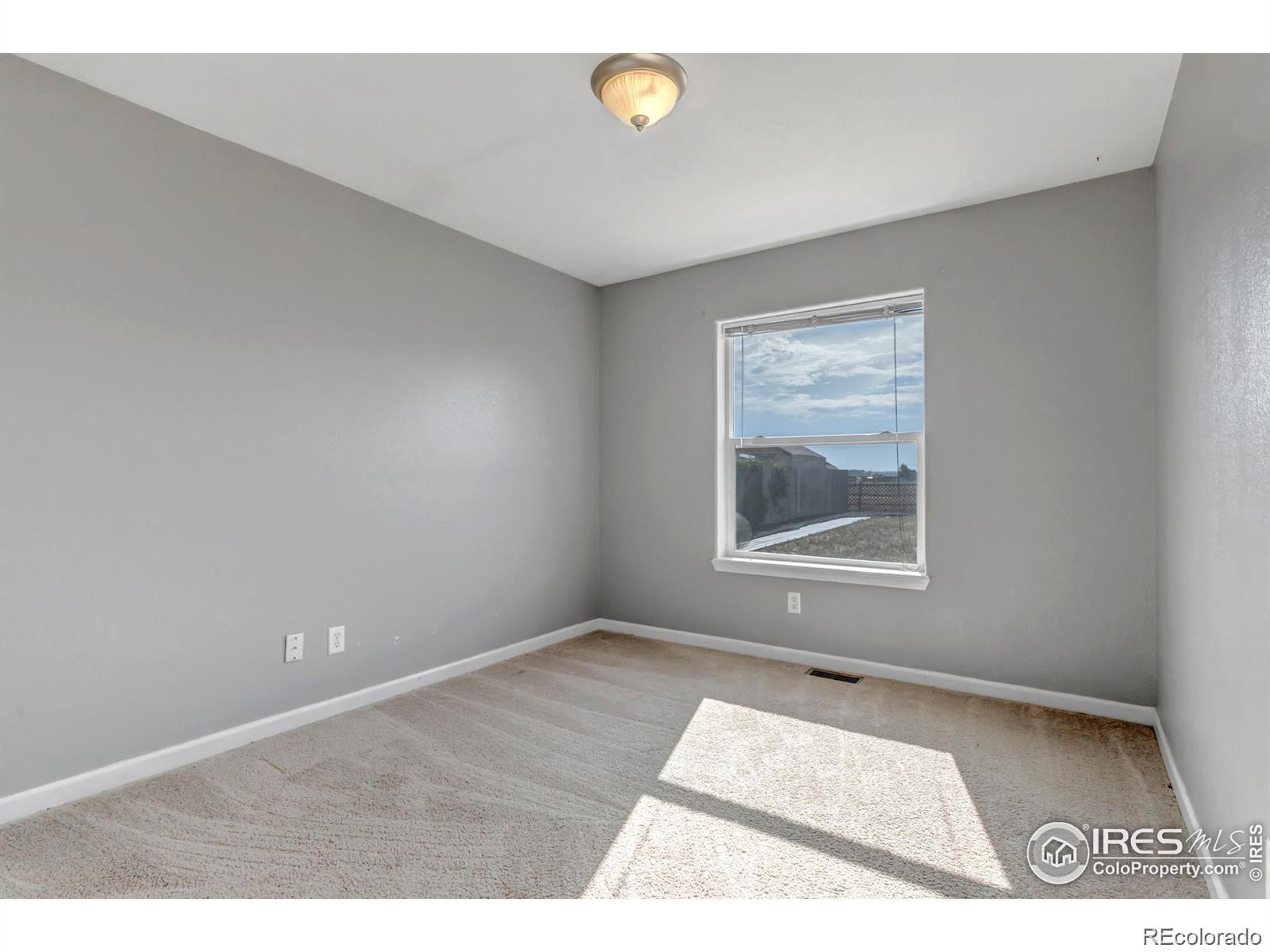 807 5th Street Pierce, CO 80650 - Photo 10 of 11 a view of an empty room with a window