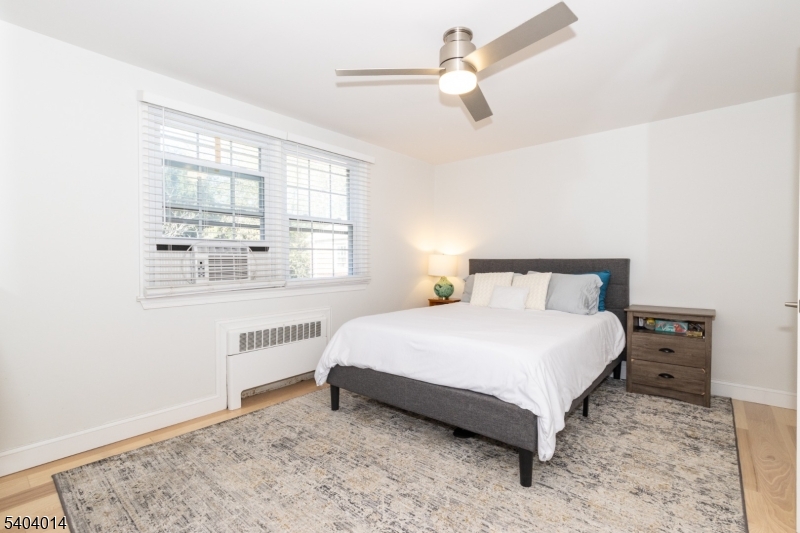 445 Morris Avenue Springfield, NJ 07081 - Photo 12 of 15 a bedroom with a bed and a window