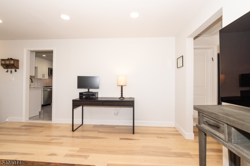 445 Morris Avenue Springfield, NJ 07081 - Photo 7 of 15 a living room with furniture and a flat screen tv