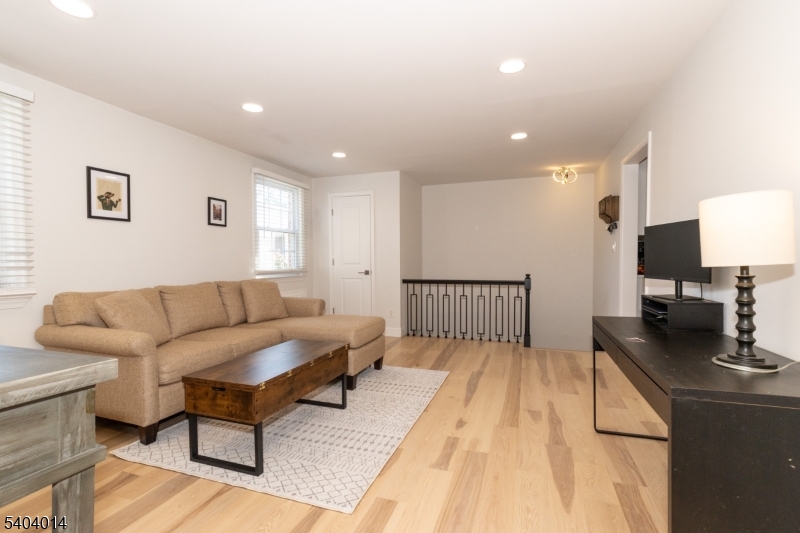 445 Morris Avenue Springfield, NJ 07081 - Photo 8 of 15 a living room with furniture and a wooden floor