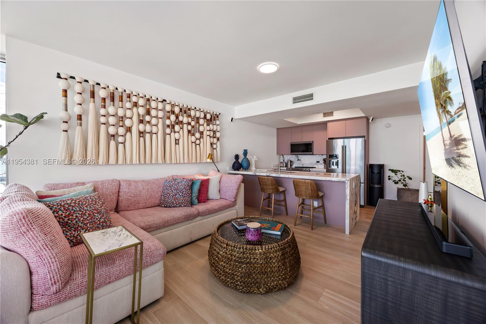 888 Biscayne Boulevard, Unit 2009 Miami, FL 33132 - Photo 4 of 21 a living room with furniture window and wooden floor