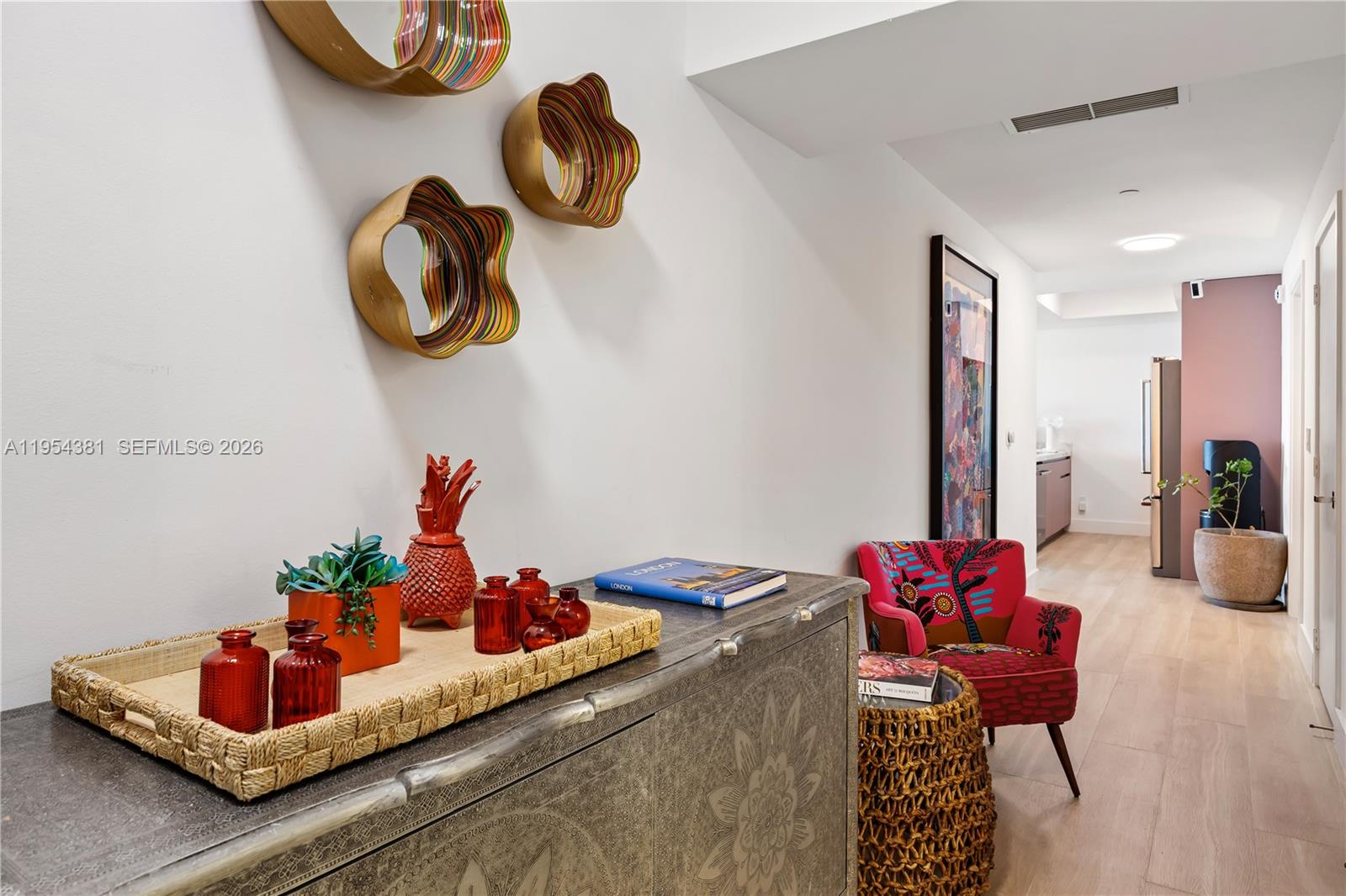 888 Biscayne Boulevard, Unit 2009 Miami, FL 33132 - Photo 9 of 21 a living room with furniture and chandelier