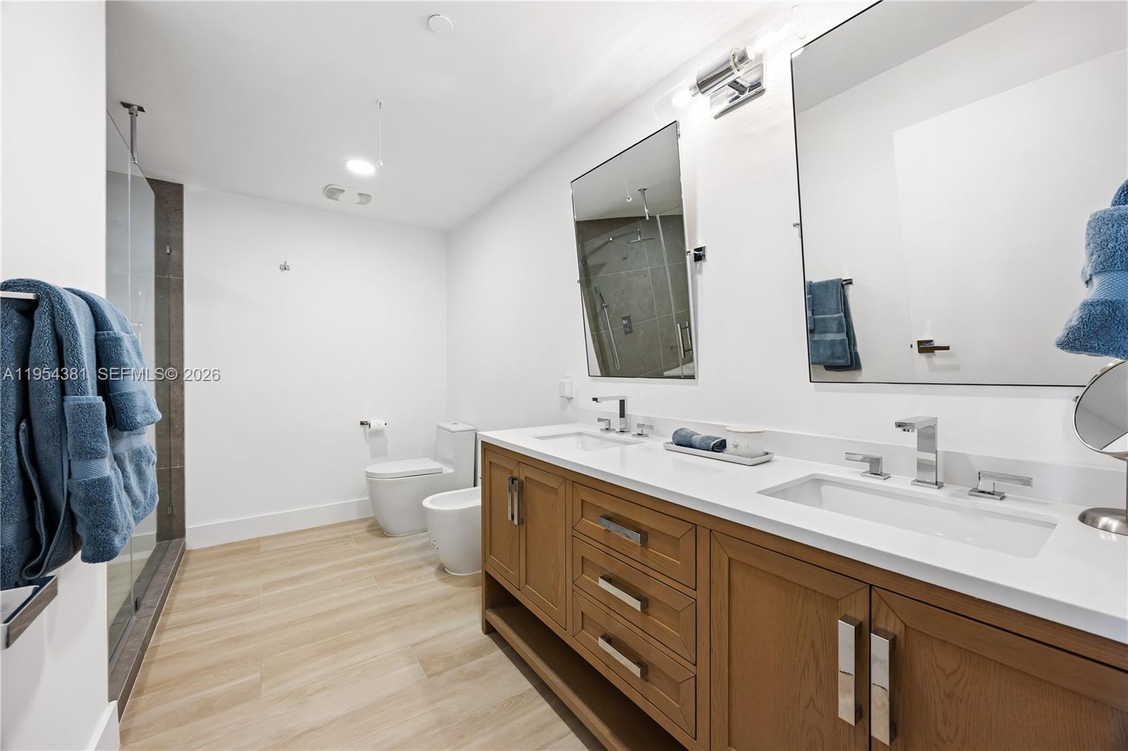 888 Biscayne Boulevard, Unit 2009 Miami, FL 33132 - Photo 10 of 21 a spacious bathroom with a double vanity sink mirror and toilet