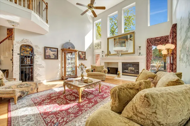 a living room with fireplace furniture and a fireplace