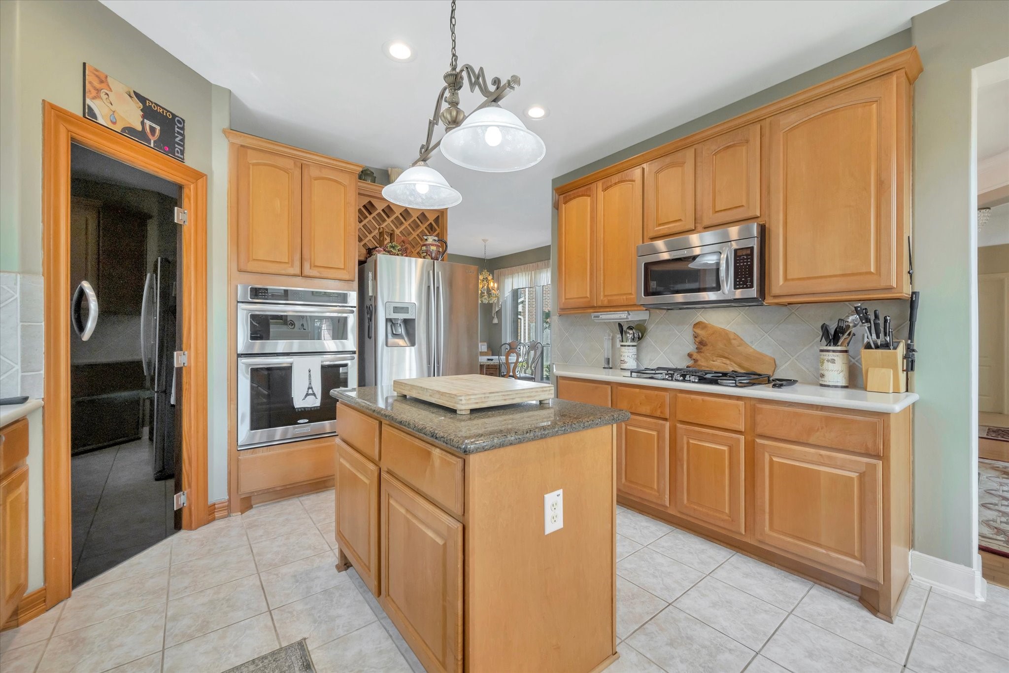 1639 Lakeside Enclave Drive Houston, TX 77077 - Photo 17 of 38 a kitchen with stainless steel appliances granite countertop a sink and cabinets