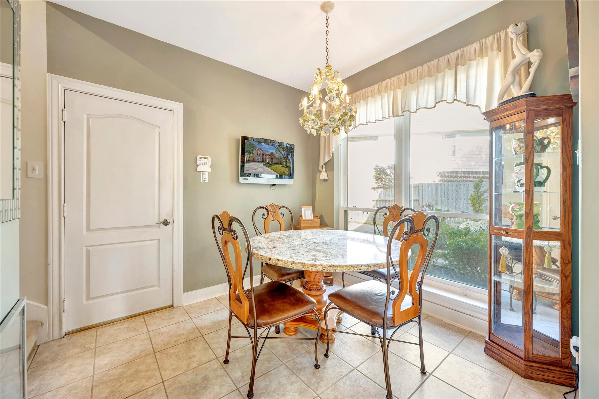 1639 Lakeside Enclave Drive Houston, TX 77077 - Photo 19 of 38 a view of a dining room with furniture window and outside view