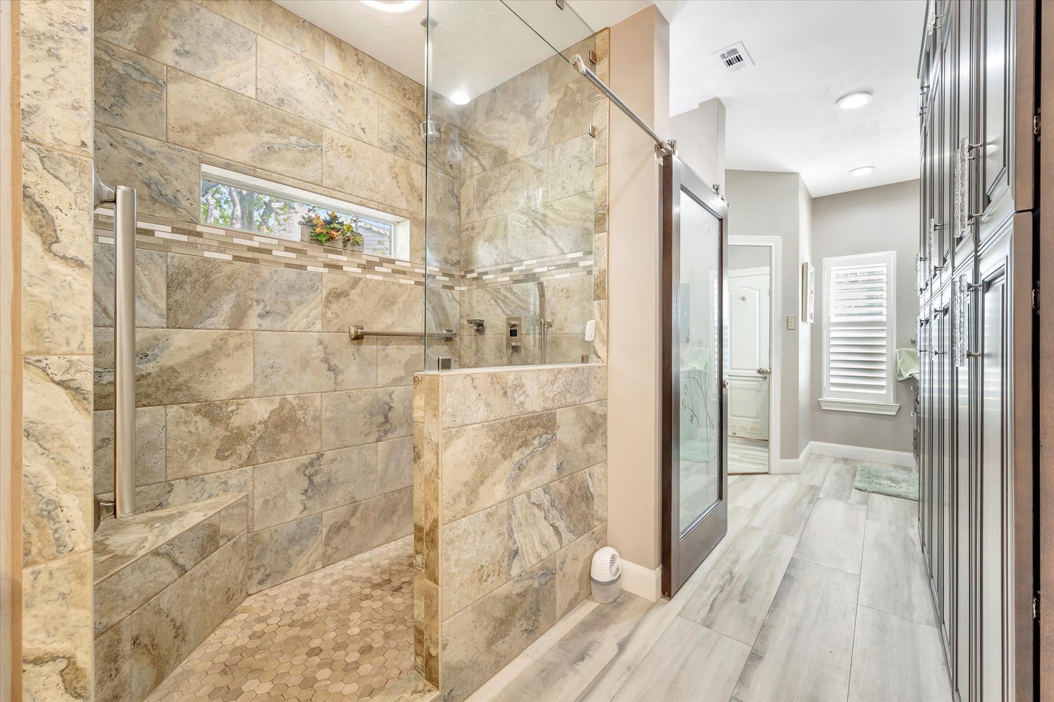 1639 Lakeside Enclave Drive Houston, TX 77077 - Photo 26 of 38 a bathroom with a glass shower door and a glass door shower