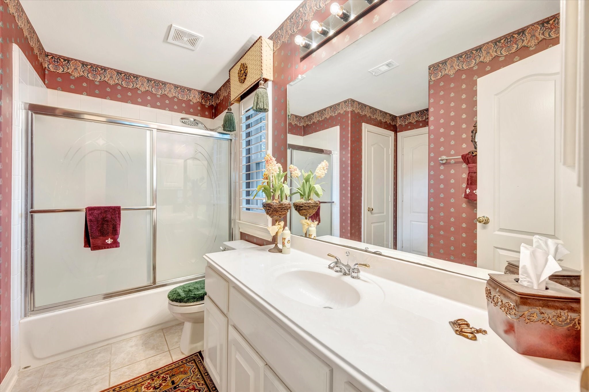 1639 Lakeside Enclave Drive Houston, TX 77077 - Photo 31 of 38 a bathroom with a sink and a mirror