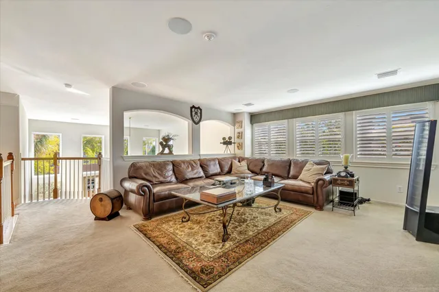 a view of a livingroom with furniture and a flat screen tv