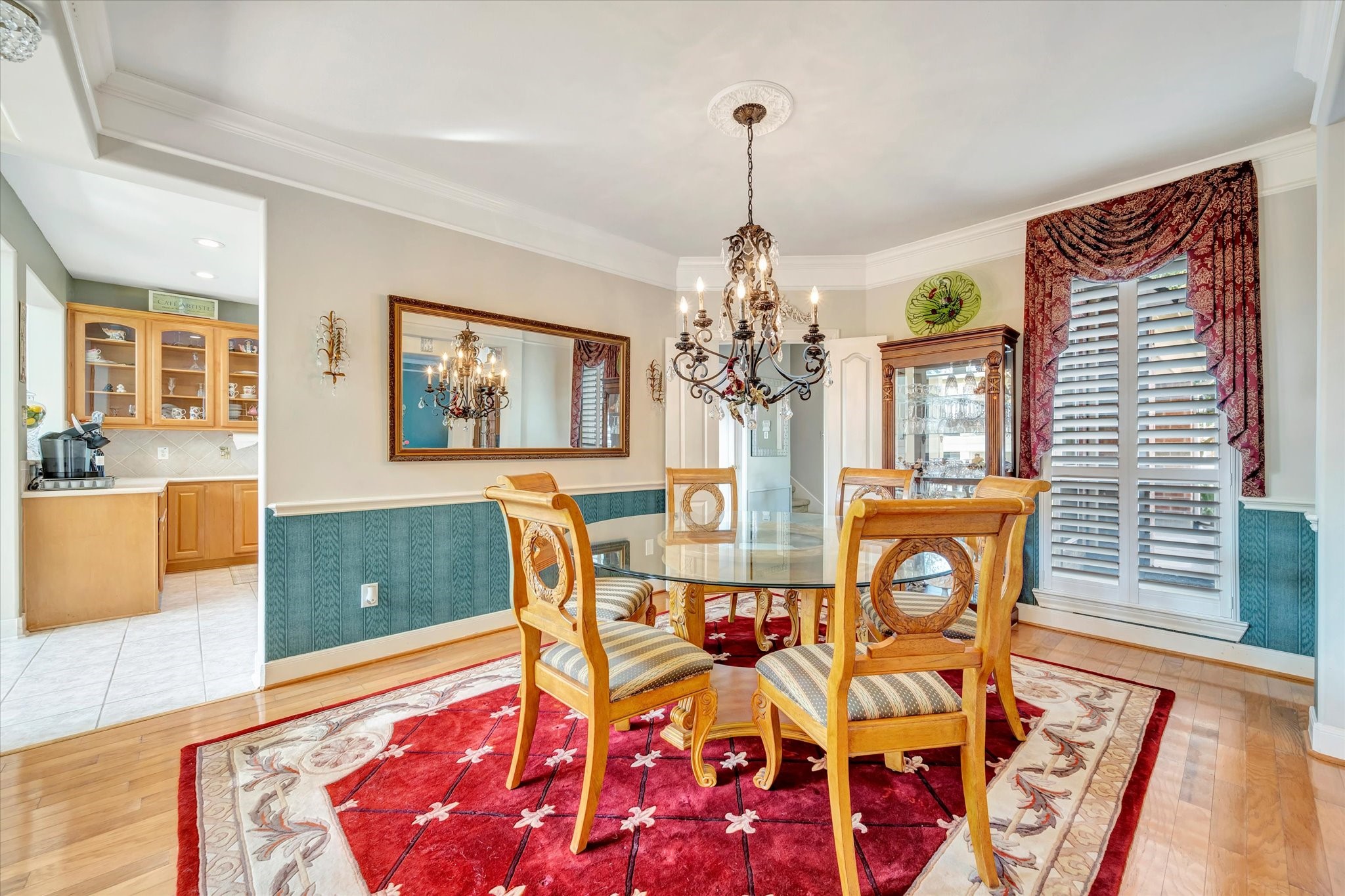 1639 Lakeside Enclave Drive Houston, TX 77077 - Photo 9 of 38 a view of a dining room with furniture and chandelier