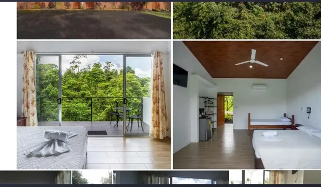 a view of a patio with table and chairs under an umbrella