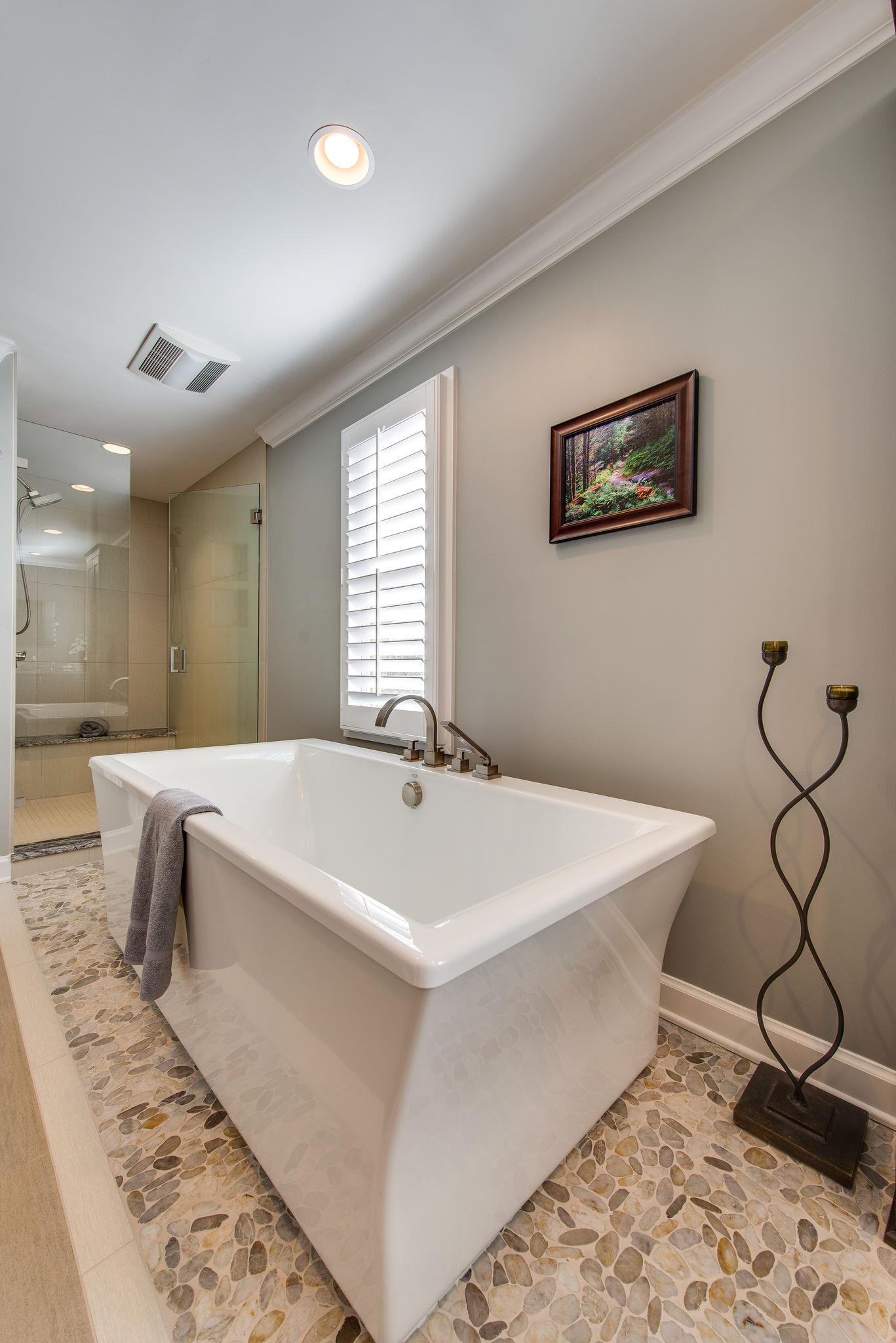 2164 Kidd Road Nolensville, TN 37135 - Photo 17 of 26 A lovely stand alone tub situated on a sea of smooth pebbles tile, immaculately installed.