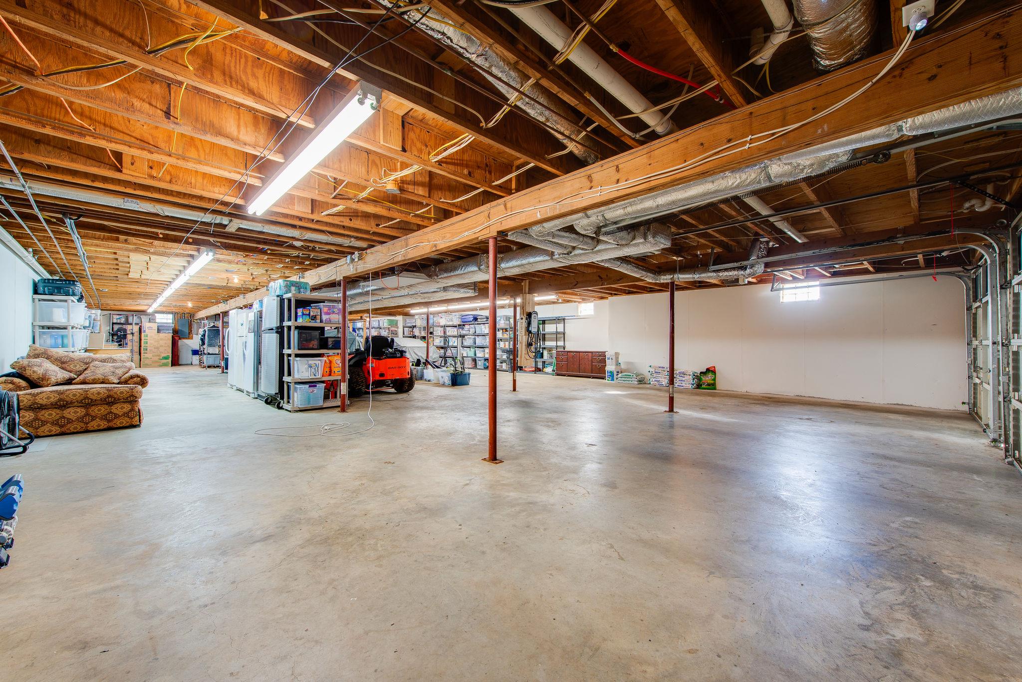 2164 Kidd Road Nolensville, TN 37135 - Photo 21 of 26 A toy lovers dream; Over 3000 sf of basement garage. Can hold 8 to 12 of your favorite cars...