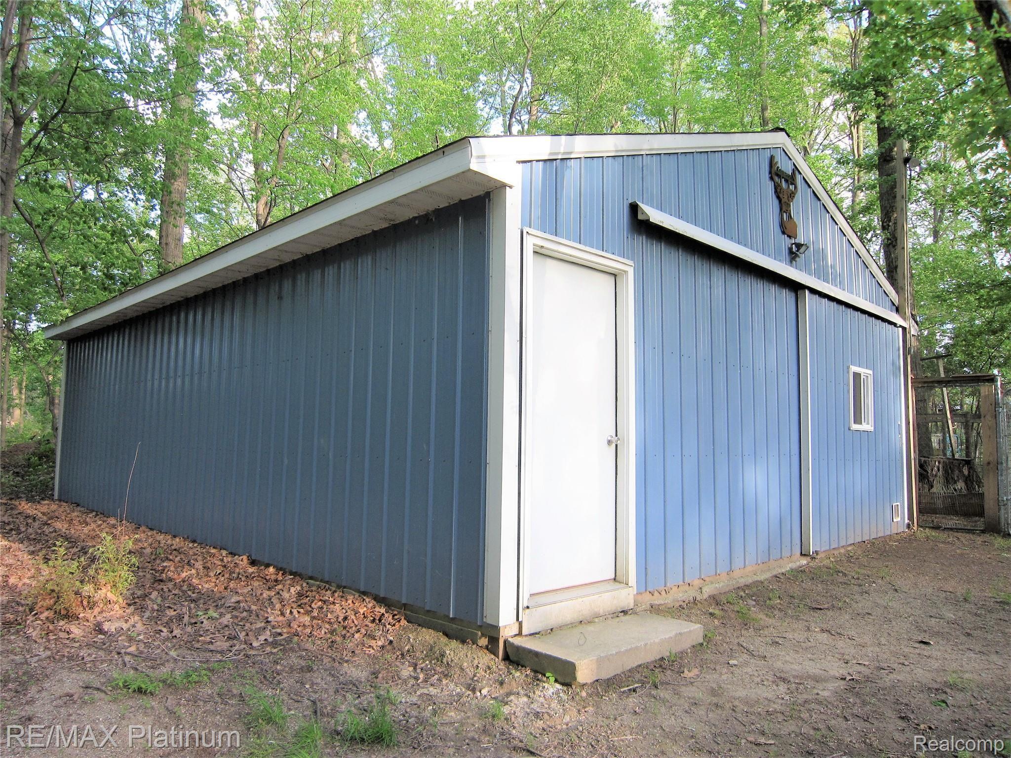 5834 Mack Road Howell, MI 48855 - Photo 11 of 53 36x24 pole barn with concrete floor and electricity