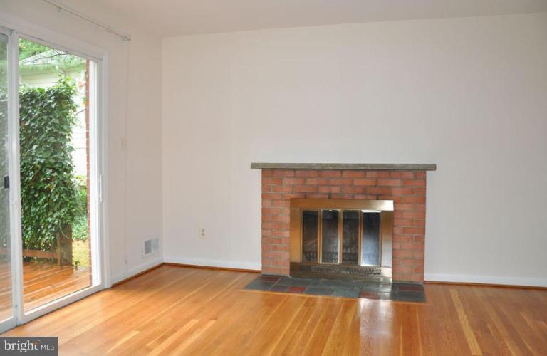 5316 Waneta Road Bethesda, MD 20816 - Photo 23 of 29 Family room off kitchen with fireplace.