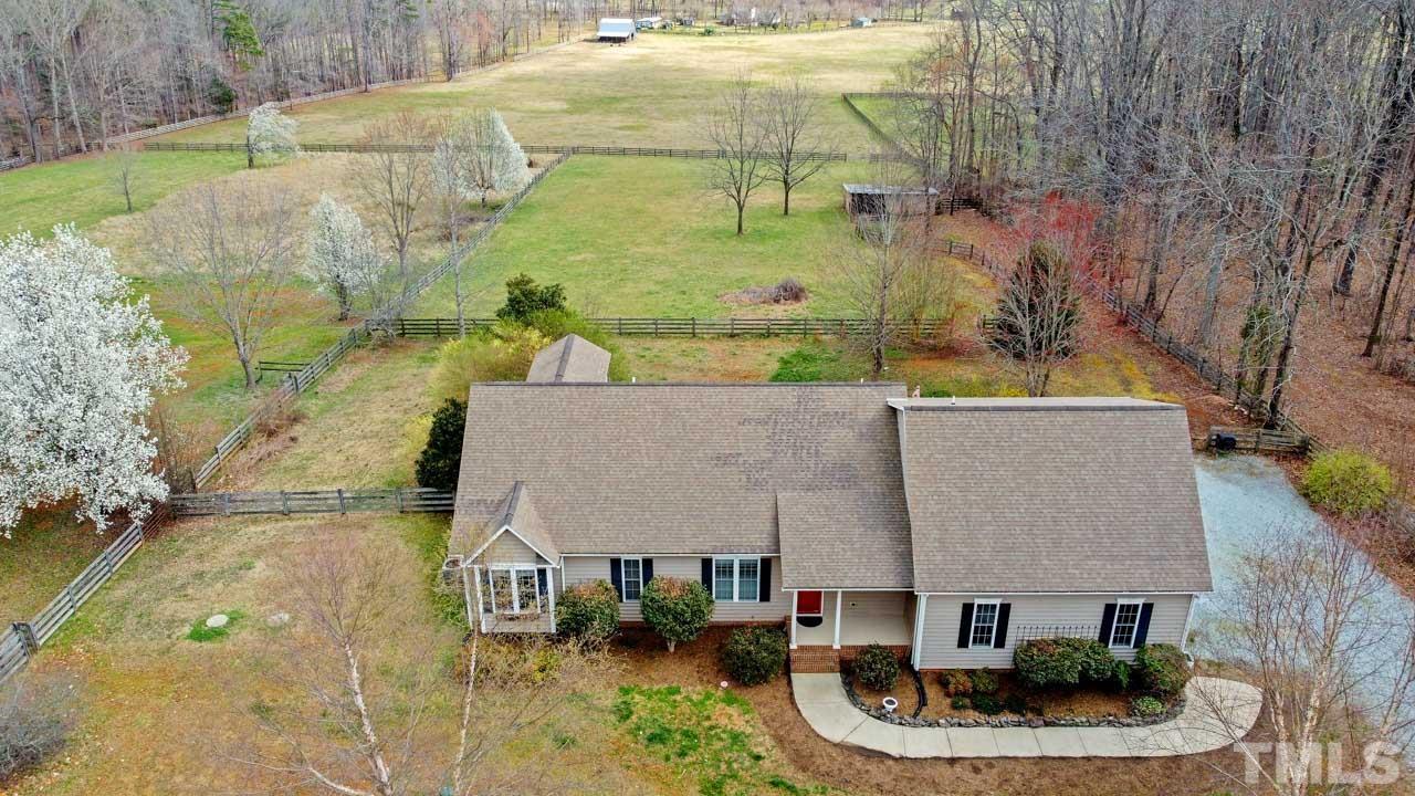 7001 New Sharon Church Road Rougemont, NC 27572 - Photo 1 of 52 an aerial view of a house with swimming pool and large trees