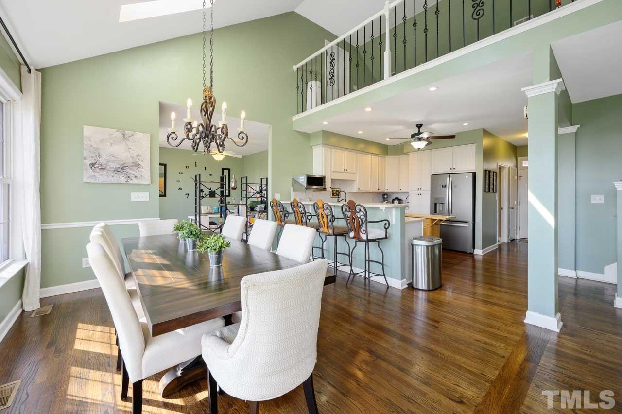 7001 New Sharon Church Road Rougemont, NC 27572 - Photo 11 of 52 a dining room with furniture a chandelier and wooden floor