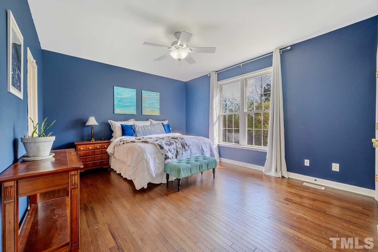 7001 New Sharon Church Road Rougemont, NC 27572 - Photo 17 of 52 a bedroom with bed and wooden floor