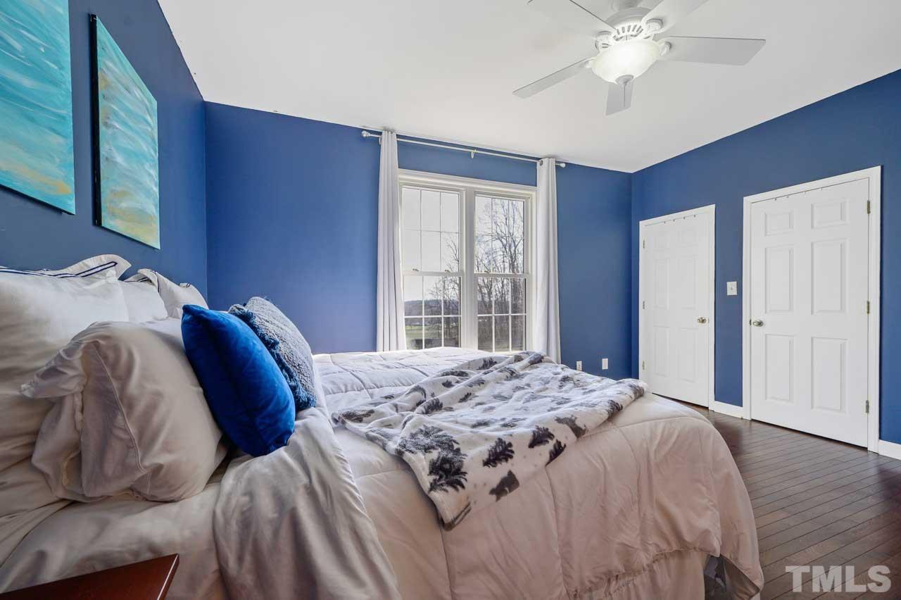 7001 New Sharon Church Road Rougemont, NC 27572 - Photo 19 of 52 a bed sitting in a bedroom next to a window