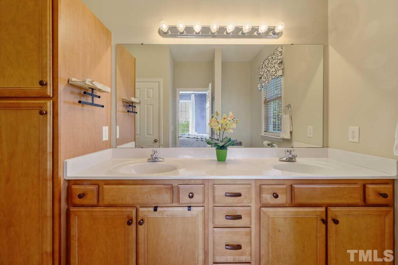 7001 New Sharon Church Road Rougemont, NC 27572 - Photo 20 of 52 a bathroom with a granite countertop sink and a mirror