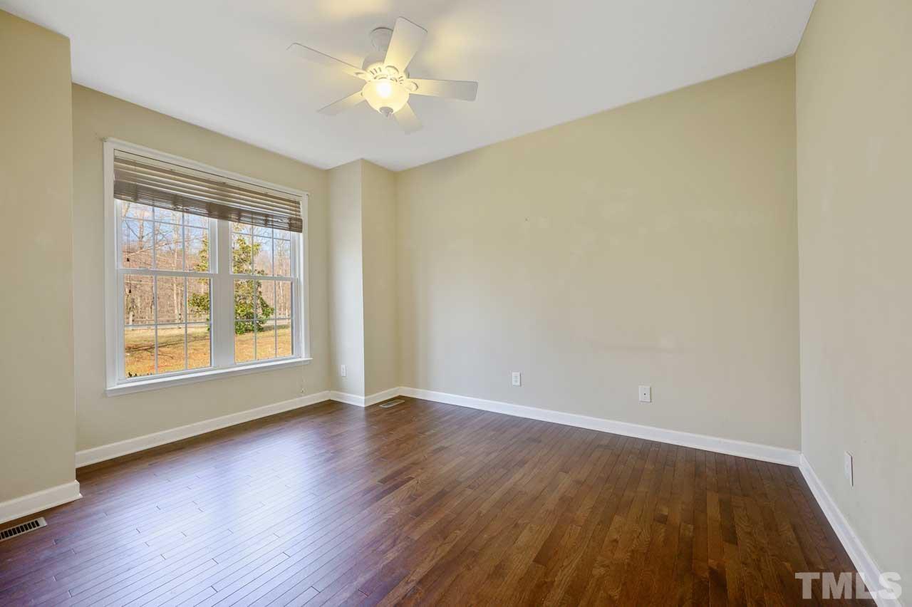 7001 New Sharon Church Road Rougemont, NC 27572 - Photo 22 of 52 a view of an empty room with a window and wooden floor