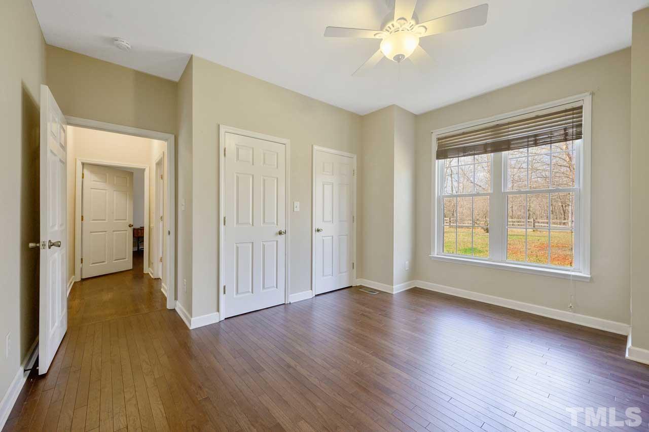 7001 New Sharon Church Road Rougemont, NC 27572 - Photo 23 of 52 wooden floor in an empty room with a window
