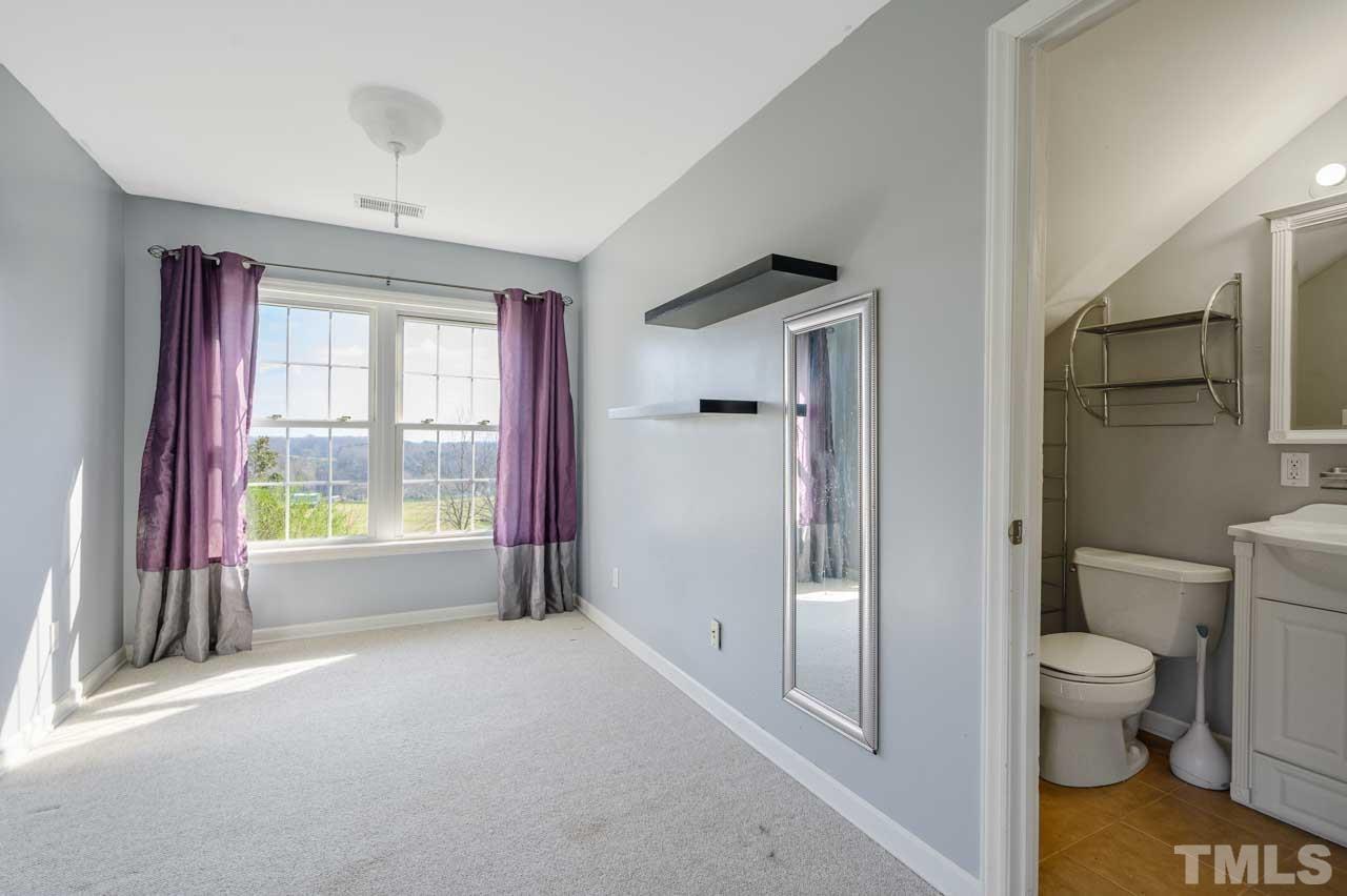 7001 New Sharon Church Road Rougemont, NC 27572 - Photo 29 of 52 a spacious bathroom with a bathtub and toilet