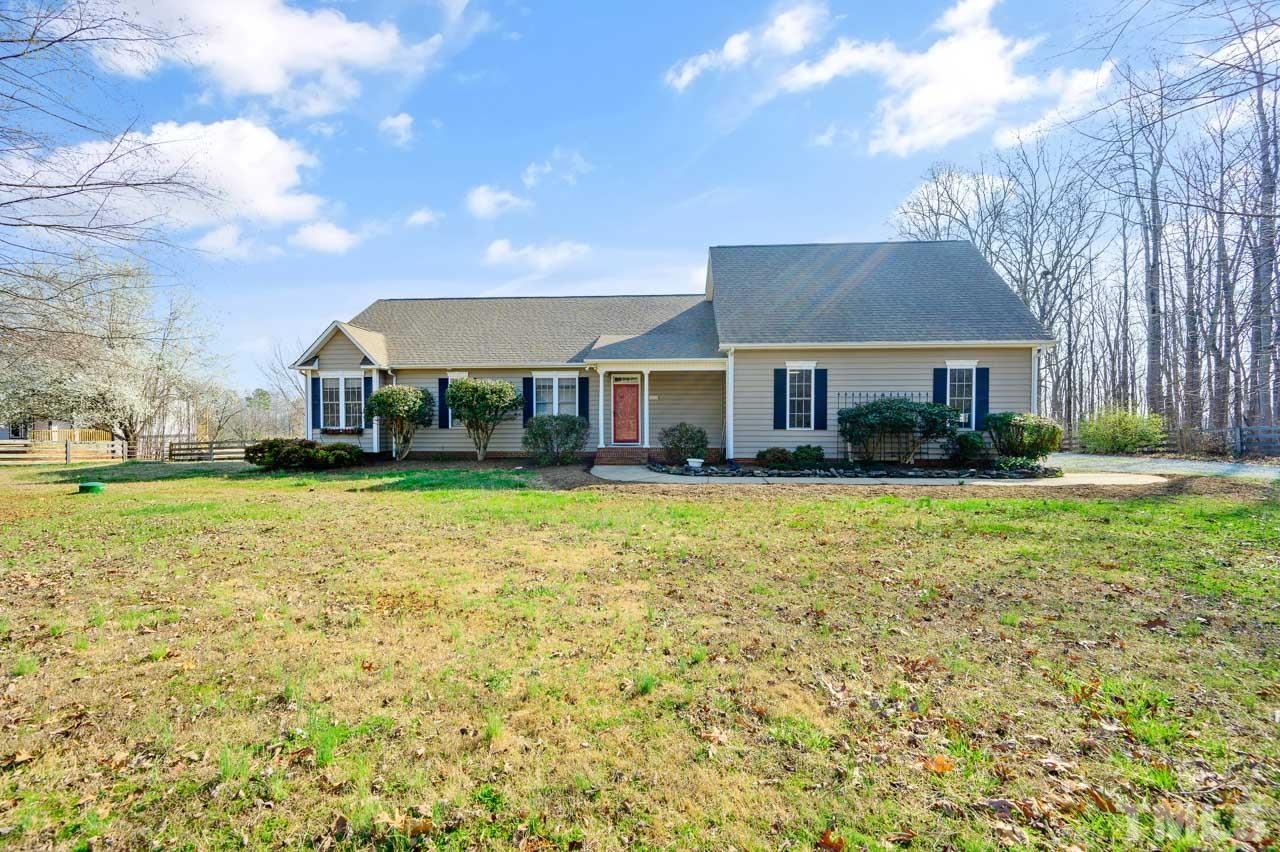 7001 New Sharon Church Road Rougemont, NC 27572 - Photo 3 of 52 a front view of a house with a yard