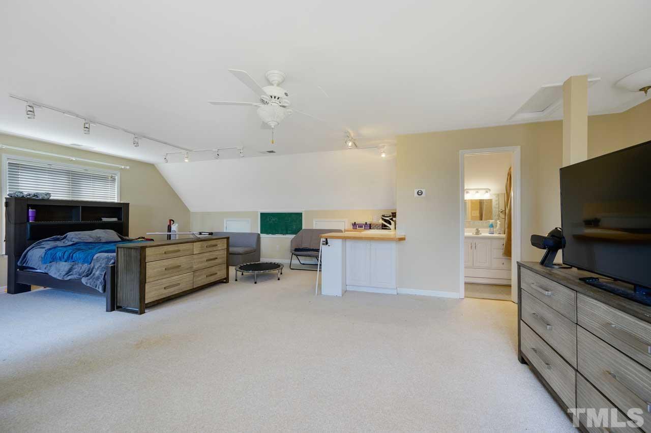 7001 New Sharon Church Road Rougemont, NC 27572 - Photo 35 of 52 a living room with furniture and a flat screen tv