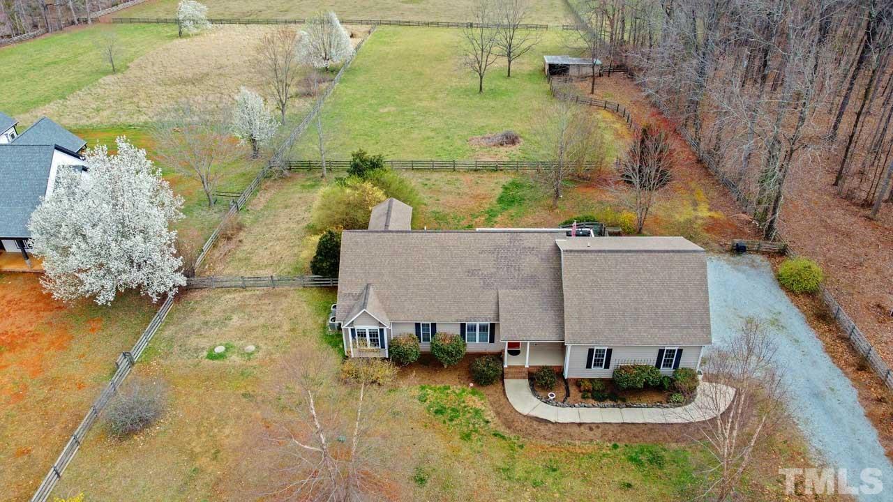 7001 New Sharon Church Road Rougemont, NC 27572 - Photo 4 of 52 a aerial view of a house with swimming pool and large trees