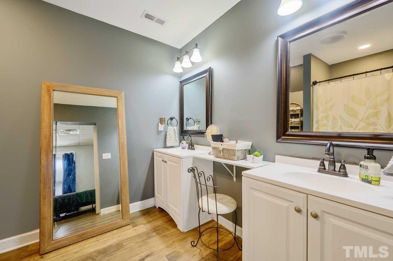 7001 New Sharon Church Road Rougemont, NC 27572 - Photo 43 of 52 a bathroom with a double vanity sink mirror and toilet