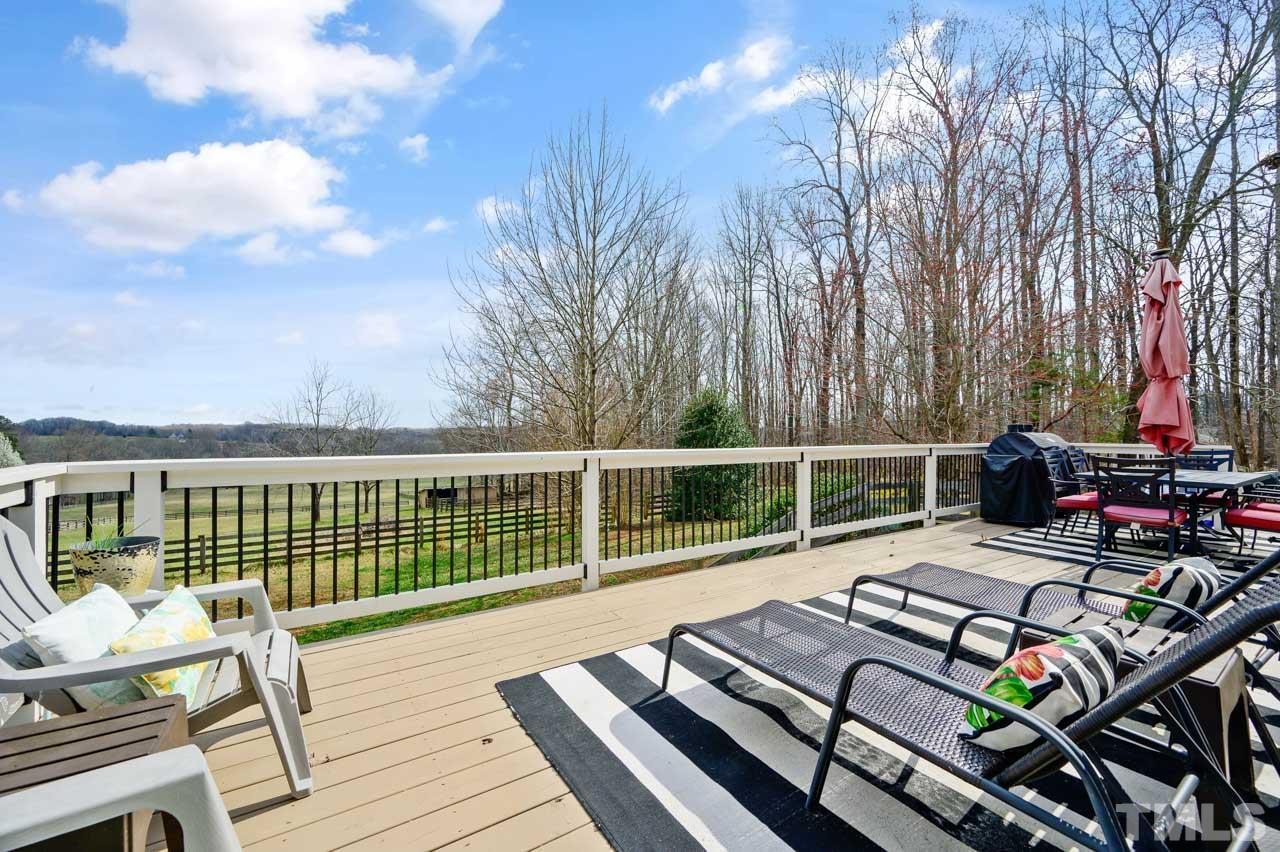 7001 New Sharon Church Road Rougemont, NC 27572 - Photo 45 of 52 a view of a roof deck with wooden floor and fence