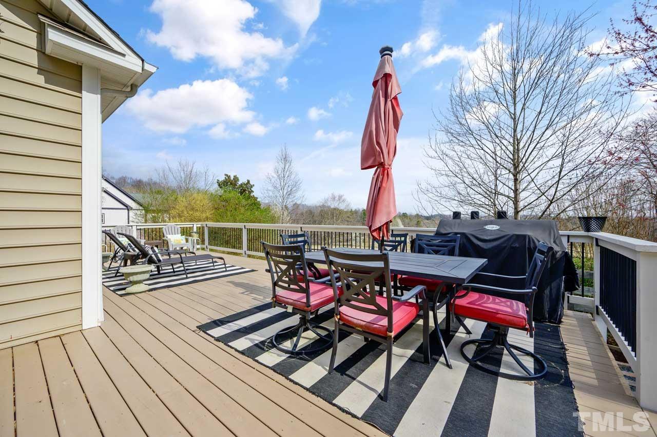 7001 New Sharon Church Road Rougemont, NC 27572 - Photo 46 of 52 a view of a balcony with chairs and wooden floor