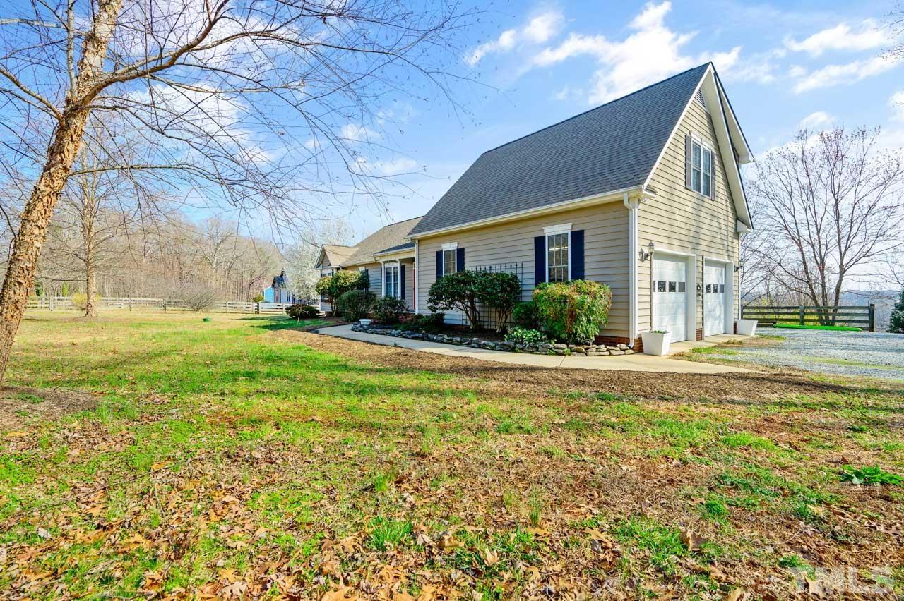 7001 New Sharon Church Road Rougemont, NC 27572 - Photo 52 of 52 a view of a house with a yard and plants