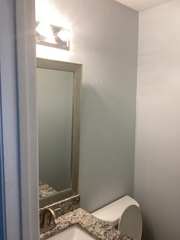 7512 Chapin Road Fort Worth, TX 76116 - Photo 21 of 25 a bathroom with a toilet