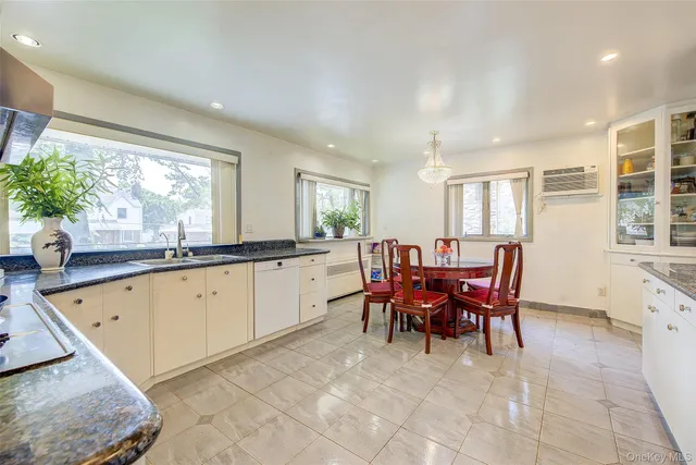 a large dining space with furniture window and outside view