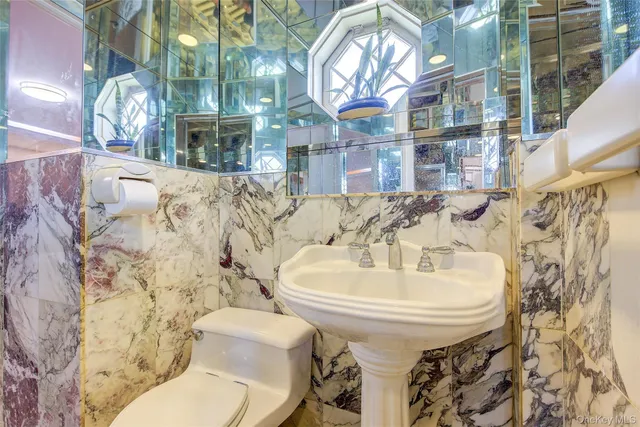 a bathroom with a sink and toilet