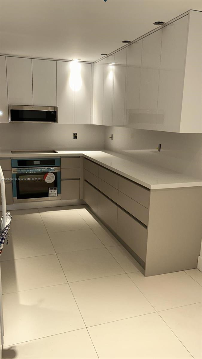 251 Crandon Boulevard, Unit 929 Key Biscayne, FL 33149 - Photo 11 of 26 a kitchen with a cabinets and appliances