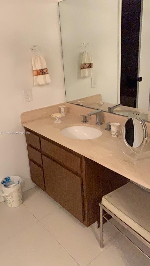251 Crandon Boulevard, Unit 929 Key Biscayne, FL 33149 - Photo 20 of 26 a bathroom with a sink vanity and a mirror
