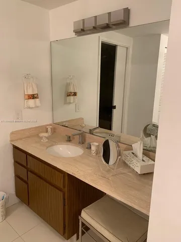 a bedroom with a bed and cupboard