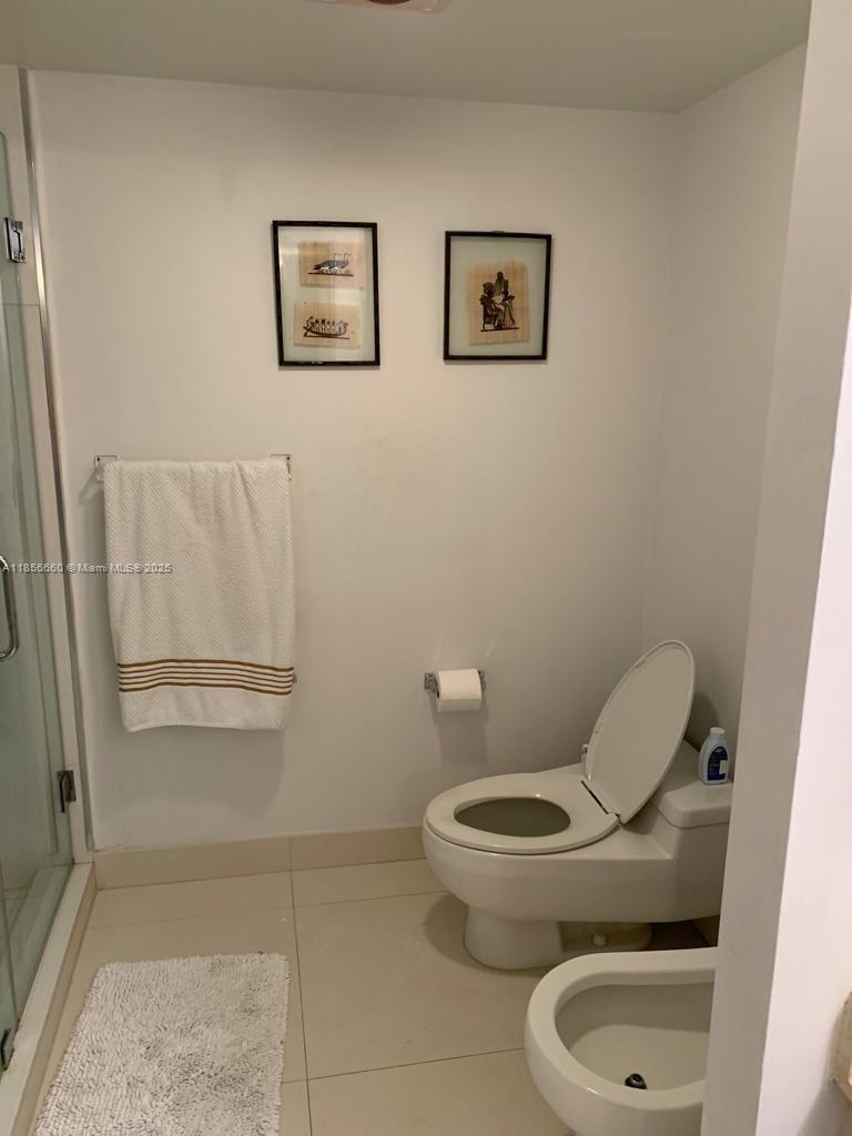 251 Crandon Boulevard, Unit 929 Key Biscayne, FL 33149 - Photo 23 of 26 a bathroom with a toilet and a vanity