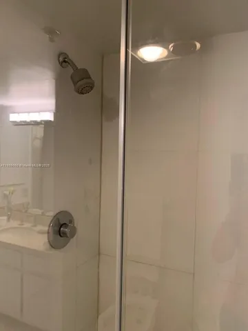 a bathroom with a tub and sink