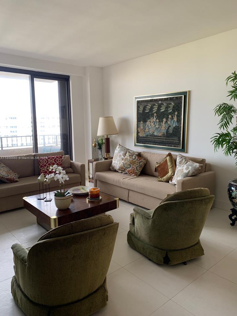 251 Crandon Boulevard, Unit 929 Key Biscayne, FL 33149 - Photo 5 of 26 a living room with furniture and a large window