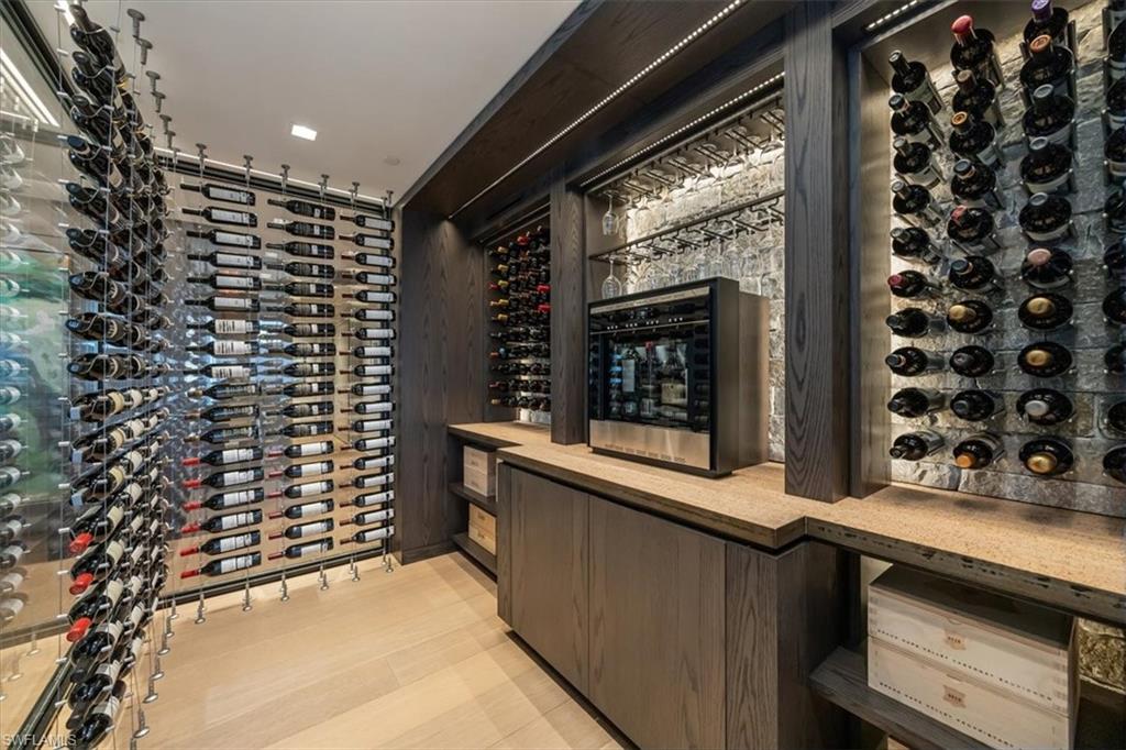 6897 Grenadier Boulevard, Unit 1701 Naples, FL 34108 - Photo 15 of 50 a bathroom with a window and a shower