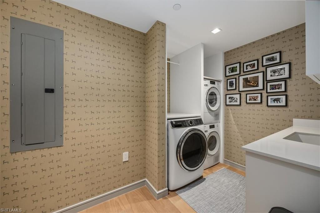 6897 Grenadier Boulevard, Unit 1701 Naples, FL 34108 - Photo 34 of 50 a utility room with dryer and washer