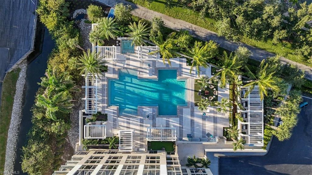 6897 Grenadier Boulevard, Unit 1701 Naples, FL 34108 - Photo 48 of 50 an aerial view of a residential apartment building with a yard