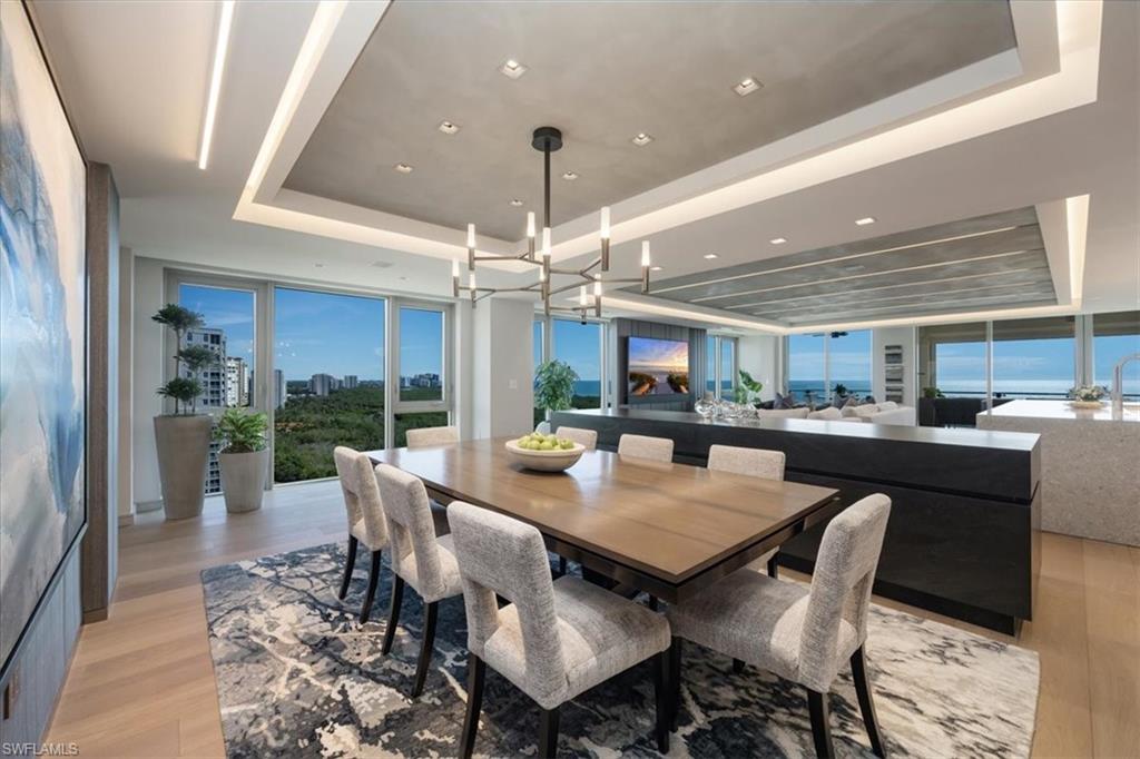 6897 Grenadier Boulevard, Unit 1701 Naples, FL 34108 - Photo 8 of 50 a view of a dining room with furniture
