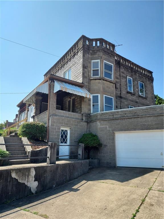 14 Wainwright Avenue Pittsburgh, PA 15227 - Photo 1 of 30 a front view of a house with garage